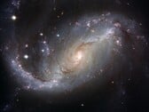 Uma imagem mostrando a galáxia NGC 1672 e as estrelas do universo. (Fonte da imagem: WikiImages - Pixabay)