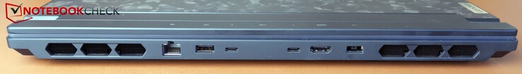 Parte traseira: alimentação, USB-A (5 Gb/s, Always-On), 2x Thunderbolt 4 (DP 1.4 e PD 3.0 140 W), HDMI 2.1, LAN